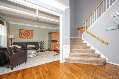 Foyer view into the living room and the stairway to the 2nd level