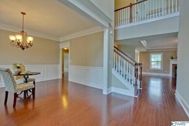 is the next thing to capture your attention as you move through the home. Can you picture children on the balcony above excitedly welcoming family & friends as they arrive for a holiday celebration?