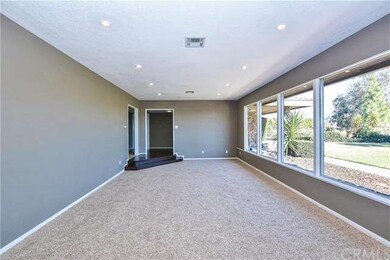 Formal living room w/ newly scraped ceilings and l