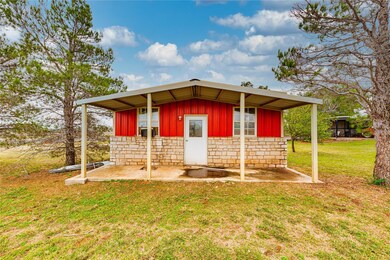 View of outdoor structure with an outbuilding
