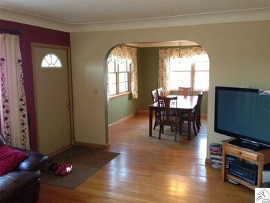 View of living room with dining room in background