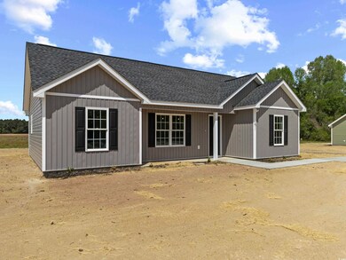 View of front of house with a shingled roof