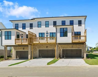 2-car rear-entry garage adds practicality and convenience. Photo not actual home, but previously built Freemont plan.