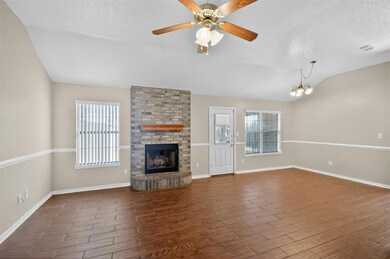 Unfurnished living room featuring lofted ceiling,