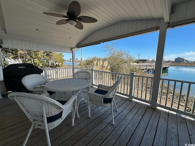 Deck featuring grilling area, a water view, and a 