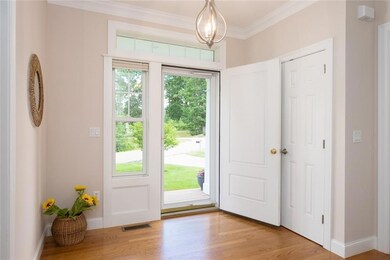 Spacious entry foyer with hardwood...