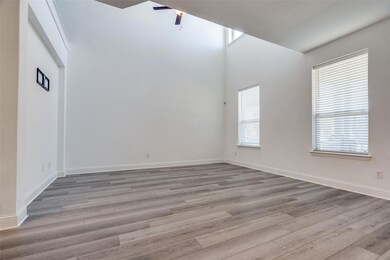 Spacious living room with new flooring downstairs!