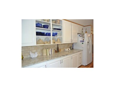 Wonderful counter space, more granite.