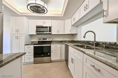 Kitchen featuring stainless steel appliances, a ra