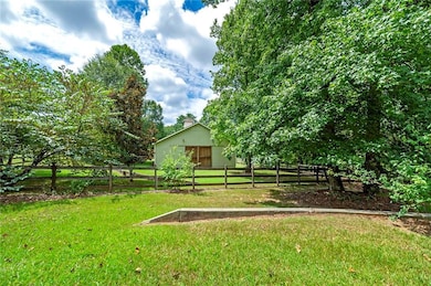 View of yard with an outbuilding and a pole building