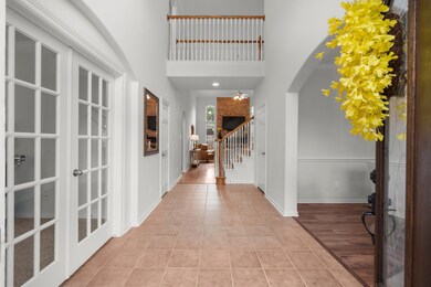Greeted by a bright, open entryway with high ceili