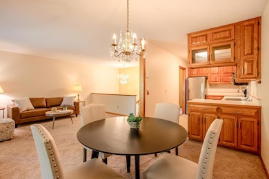 Intimate dining area with sliding glass doors leading to the 3-season porch—bringing natural light and fresh air inside.