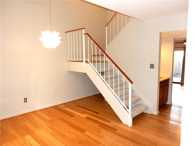 Two story dining room with stairs to second floor,