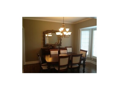 Large dining room with hardwoods and natural light