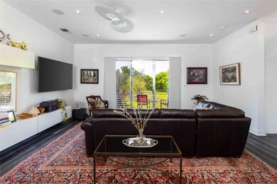 Living area featuring recessed lighting, wood fin