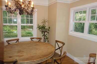 Dining Room: Inviting dining room, iron chandelier