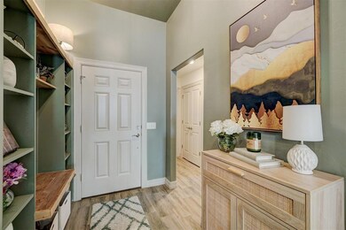 Mudroom with light hardwood / wood-style floors