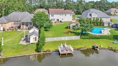The private lake is stocked with fish and offers peaceful views from the backyard and dock.