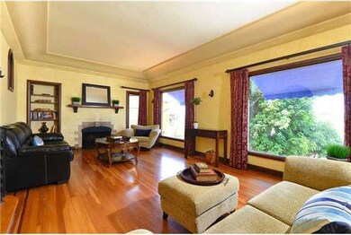 Gorgeous hardwood floors and cozy fireplace make t