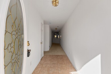 With a decorative glass front door and a fresh coa