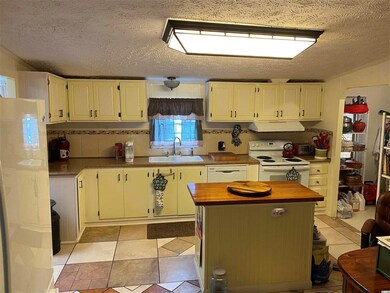 View thru kitchen, left is sunroom; right is laund