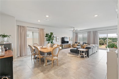 Dining room with a ceiling fan, recessed lighting,