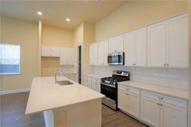 Kitchen featuring stainless steel appliances, a s