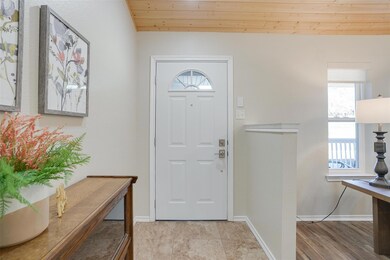 Entry into open concept living and dining room ( hall closet behind )