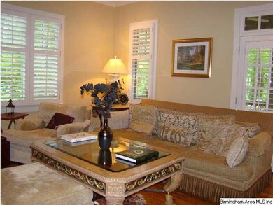 French doors adorned with plantation shutters open