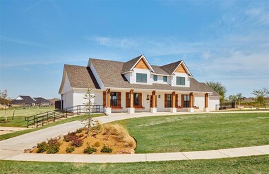 Modern inspired farmhouse featuring a shingled roof and a porch