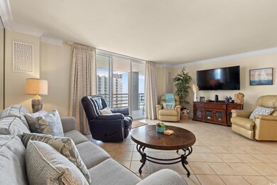 Living room featuring expansive windows, crown mol