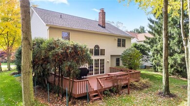 Rear view of house and newly stained deck