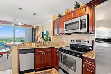 Kitchen featuring a ceiling fan, appliances with s