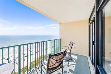 Balcony with a view of the beach and a water view
