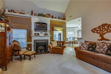 Great living area allows for both formality and day to day use for everyone.  Beautiful fireplace is the central feature in this room that has lots of light and a high ceiling.  Sophisticated yet informal enough for the family to use.  