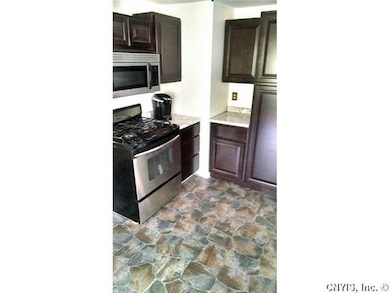 Kitchen. Gorgeous flooring and plenty of cabinets 