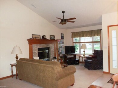 Living room area features Brick gas fireplace