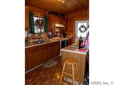 Kitchen. Kitchen opens to family room separated by
