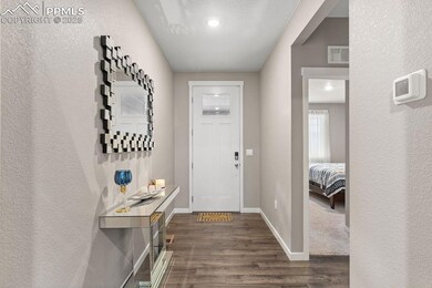 Entryway featuring baseboards, visible vents, a te