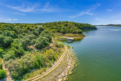 Aerial view of a nearby body of water and a forest