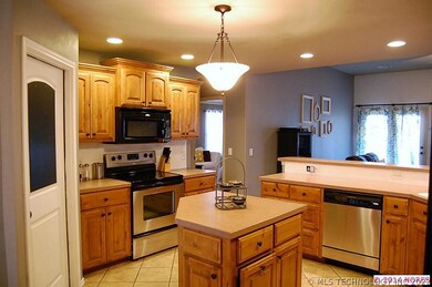 Stainless steel appliances and tile floors.