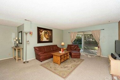 Large Living room opens to covered patio