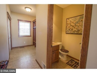 Powder room on main level is convenient to the kit