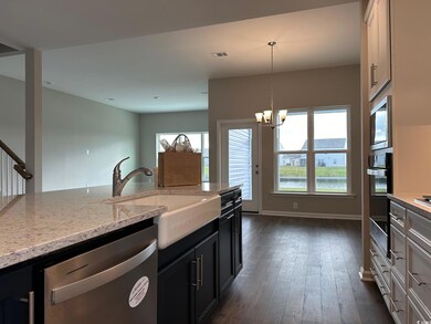 Kitchen featuring pendant lighting, a chandelier, 