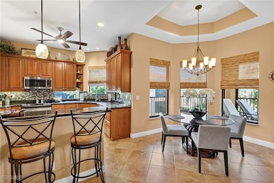 Kitchen with brown cabinetry, open shelves, plenty of natural light, tasteful backsplash, and recessed lighting