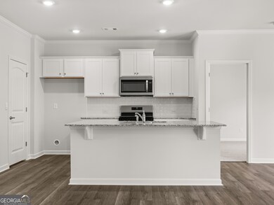 Aria updated kitchen with a large center island for plenty of bar seating