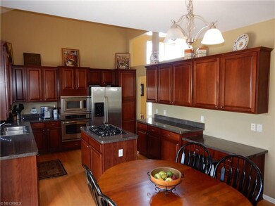 Eat-in kitchen with cherry cabinets, planning desk