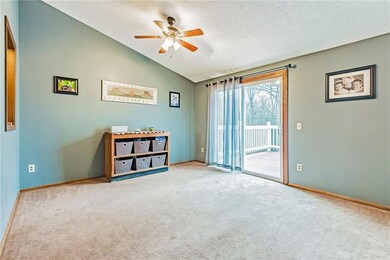 Dining room with sliders to deck overlooking woods