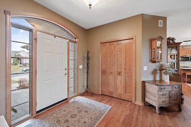 Large entry with arched transom window