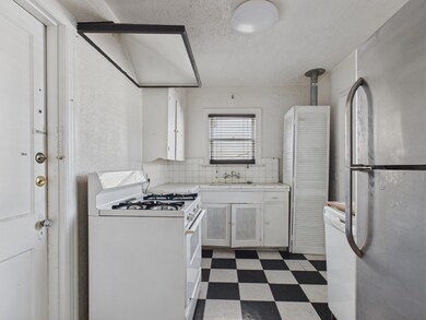 Efficiency Kitchen with Gas Range, Dishwasher & Fridge